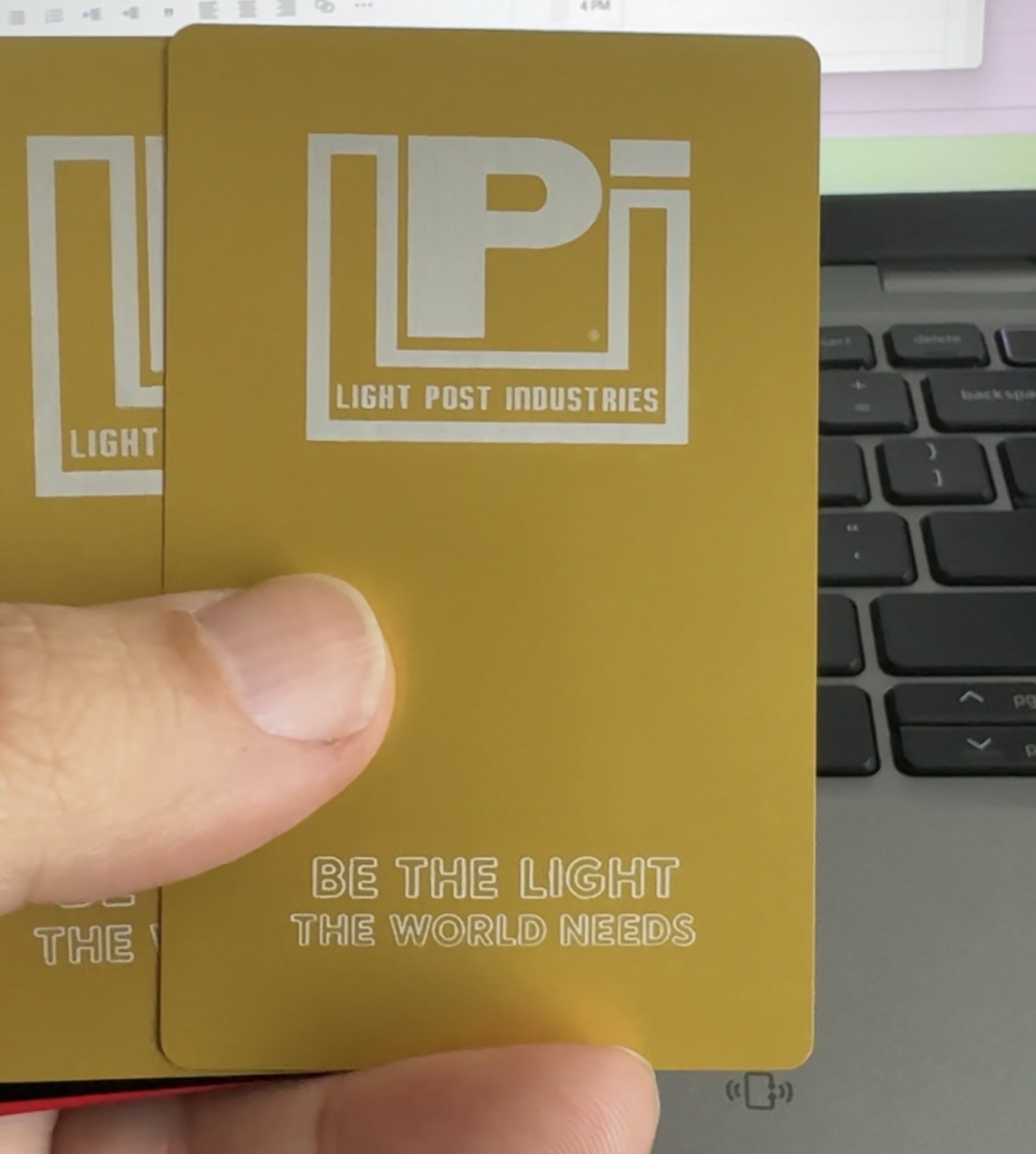 Gold anodized aluminum business card
