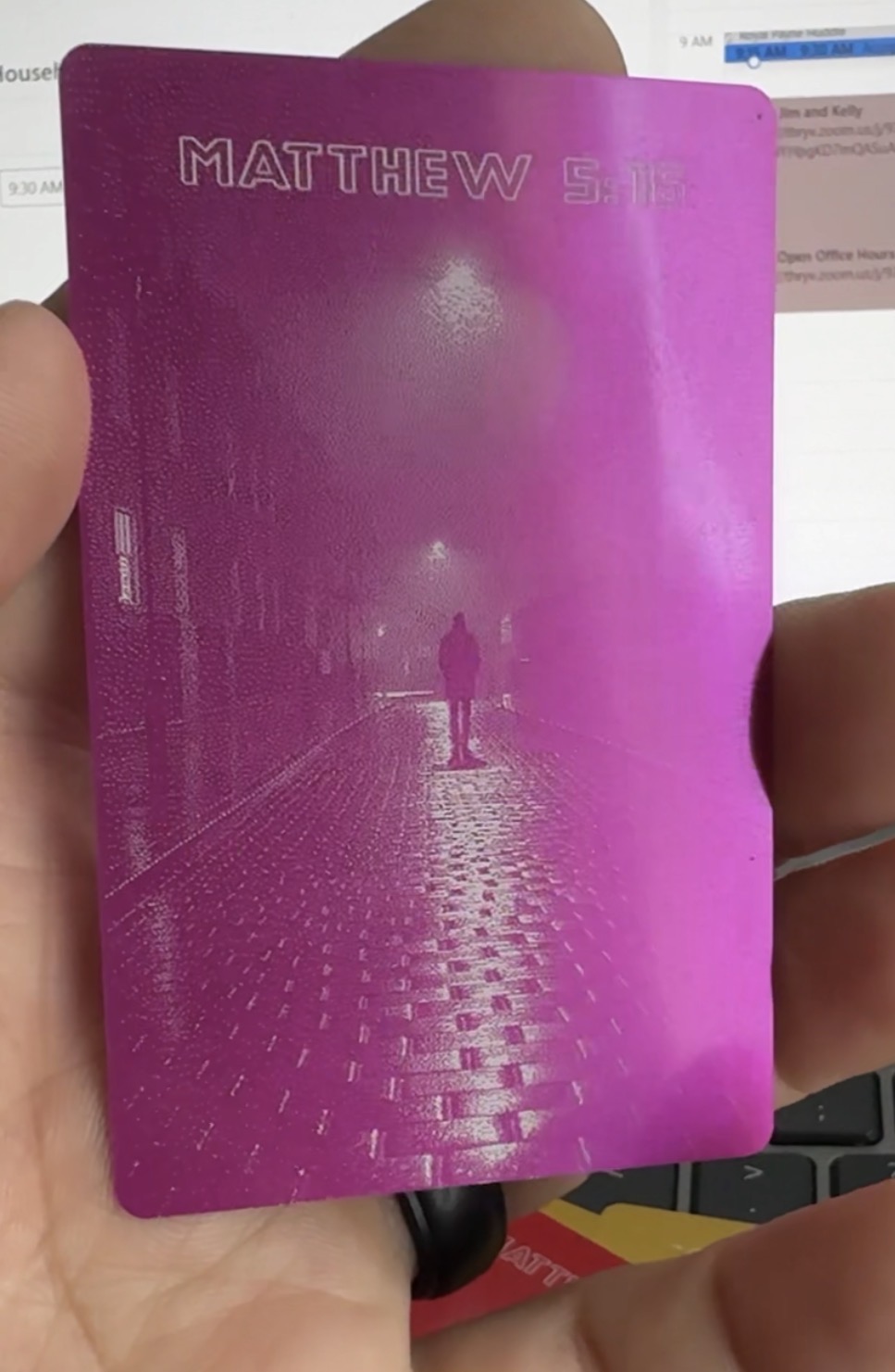 Back of hot pink anodized business card