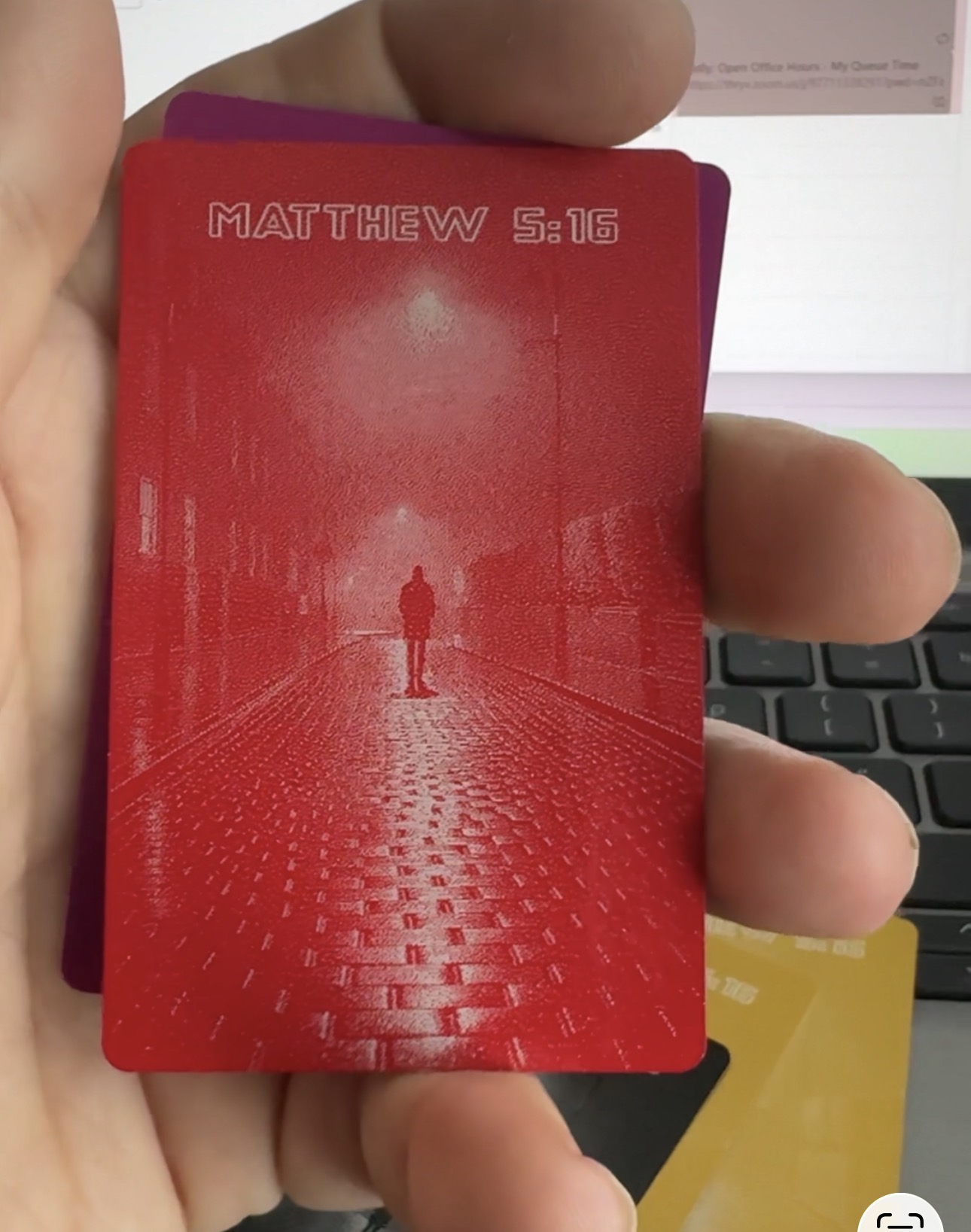Back of red anodized business card
